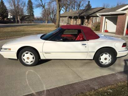 white buick reatta convertible with red ragtop