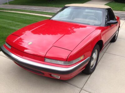 1990 red buick reatta convertible with tan ragtop