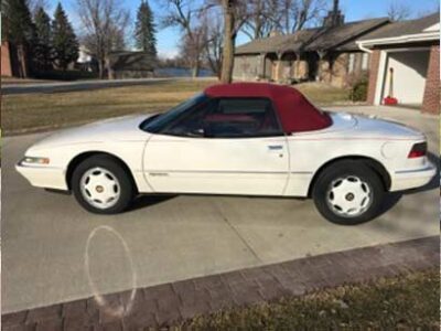 white buick reatta convertible with red ragtop